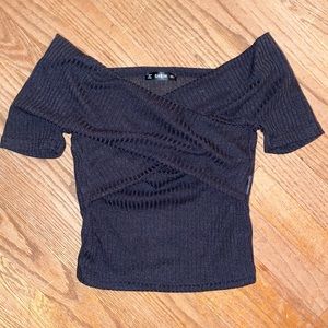 Black off the shoulders top. Fits really small